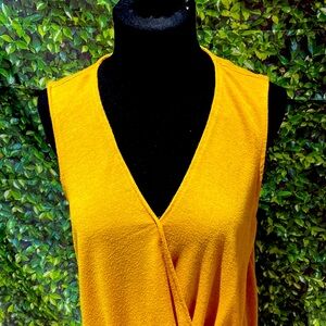 A gold blouse that is perfect for spring time picnics and summer activities